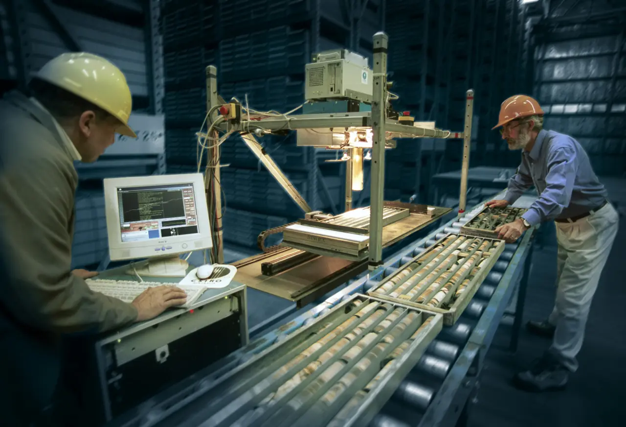 Drill core being scanned and logged