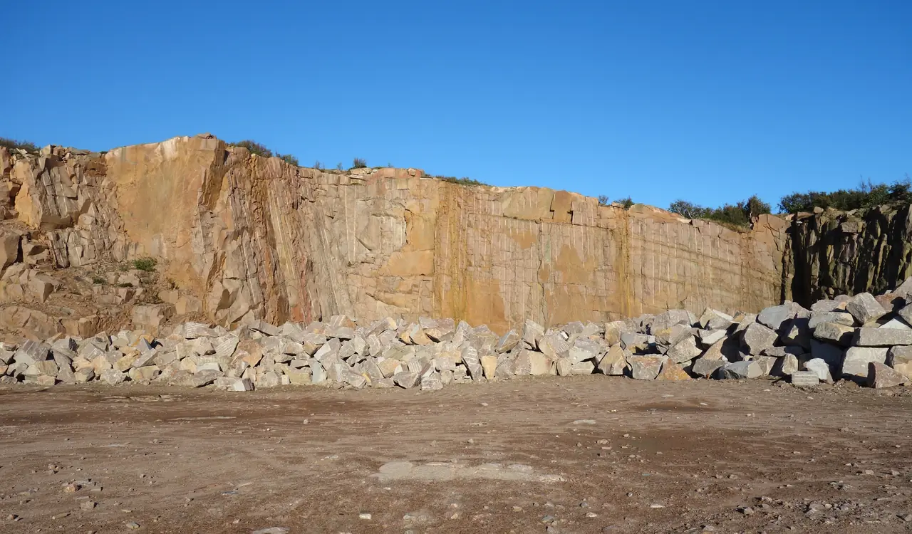 Granite quarry face with cut blocks